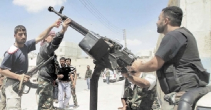 ЕС собирается вооружать сирийских мятежников - фото